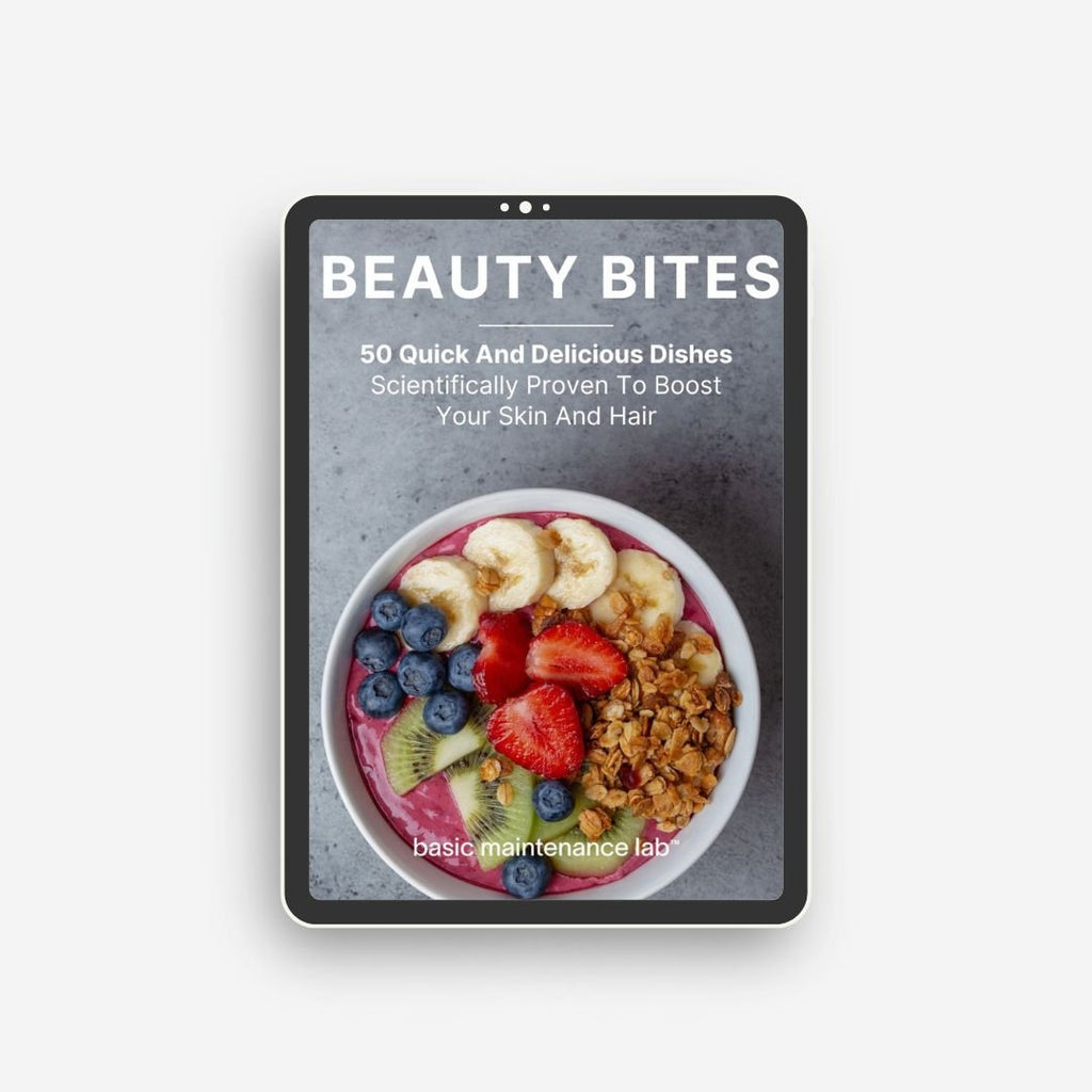 The Beauty Bites Recipe Guide by Basic Maintenance features a cover with a bowl of granola, bananas, strawberries, blueberries, and kiwi and highlights 50 quick, delicious dishes for skin and hair health.