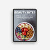 The Beauty Bites Recipe Guide by Basic Maintenance features a cover with a bowl of granola, bananas, strawberries, blueberries, and kiwi and highlights 50 quick, delicious dishes for skin and hair health.