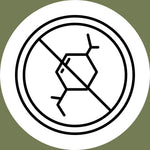 A black and white symbol of a molecule with a diagonal line through it, inside a circle, indicating no chemicals or chemical-free, on a green circular background.