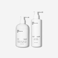 Two white pump bottles from Basic Maintenance, labeled Picture-Perfect Face (Super Boost) and The Face Wash, each 236 mL (8oz) with minimalist labels and product details, stand on a white background.