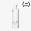 A white pump bottle of Basic Maintenance The Body Wash (500 ml/16.9 oz) stands upright with a black SPY 2023 Best Body Wash award logo and laurels at the top right.