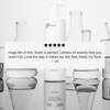 A bottle of Basic Maintenance The Body Wash sits among glass beakers. A five-star review overlay reads: “Huge fan of this. Scent is perfect. Lathers on exactly how you want it to. Love the way it makes my skin feel. Easily my fave. - J.K.”.