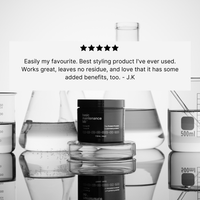 A jar of The Protein Pomade by Basic Maintenance sits on a reflective surface, surrounded by laboratory beakers. Above it, a customer review and five-star rating are displayed.