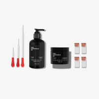 The Basic Maintenance Guys Grooming Upgrade set includes three droppers with red handles, a black pump bottle, a black jar, and four small glass vials with corks—all arranged on a white background.