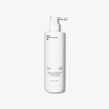 A white pump bottle labeled The Shampoo by Basic Maintenance, featuring minimalist black text, stands upright on a plain white background. The bottle contains 354 mL (12oz) of product.